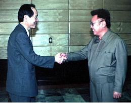 Kim Jong Il shakes hands with South's Unification Minister Park